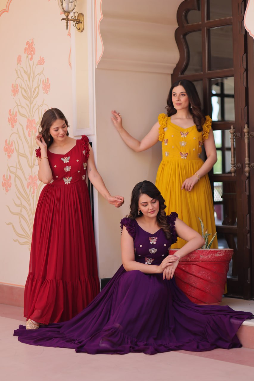 Lavi 7-meter flared designer gown in faux blooming fabric with sequin & bead embroidery, V-neck & frill shoulders – perfect for weddings & parties.